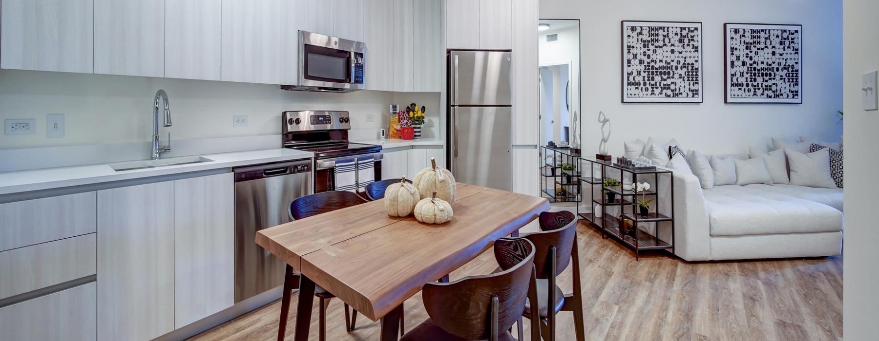 a kitchen with a table and chairs