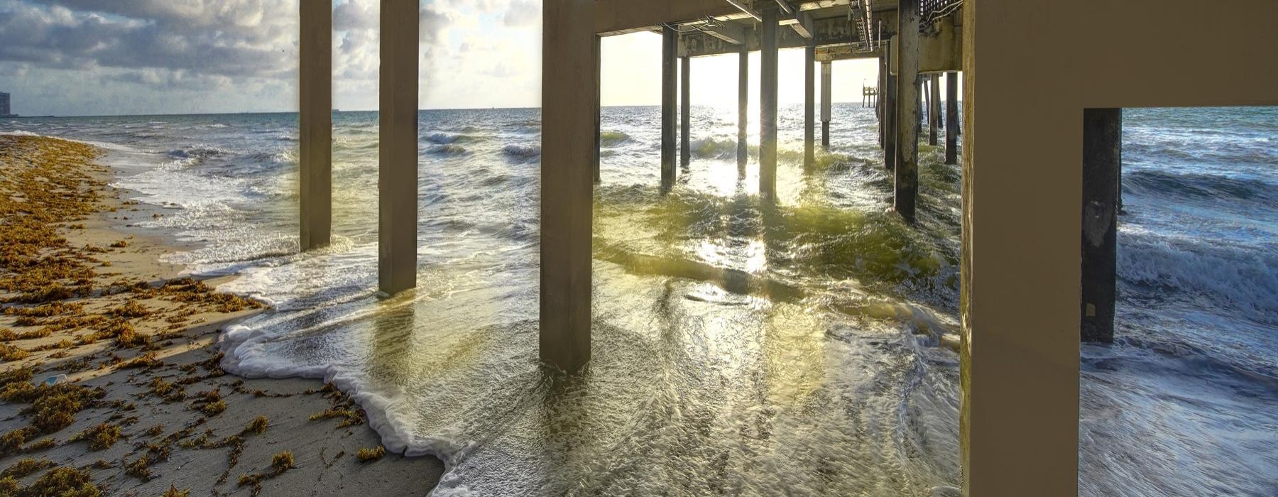 a body of water with a bridge over it